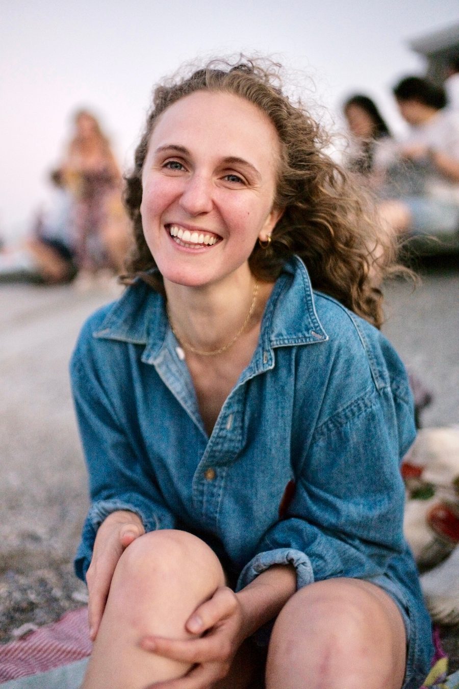 Hope Endrenyi smiling, sitting outdoors